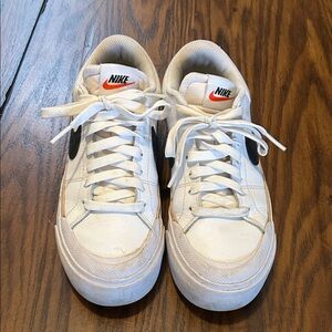 Nike White Sneakers with Black and Orange Accents